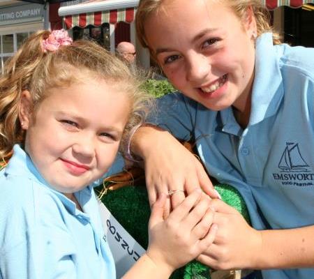 Two younger visitors model the Festival polo Shirt